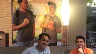 The two friends pose in front of their poster. (Left) Christian Toledo (Right) Jevh Maravilla.