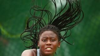 Adetayo Adetunji of Nigeria competes in the Girl"s Singles Quarterfinal tennis match between Zeel Desai of India and Adetayo Adetunji of Nigeria on day 4 of the 2017 Youth Commonwealth Games at QE Sports Centre on July 21, 2017 in Nassau, Bahamas.