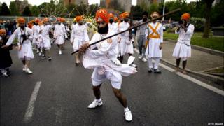 Indian Sikh pilgrims parade on April 13, 2014 in Bobigny, near Paris, during celebrations for Vaisakhi, the Sikh New Year Festival,