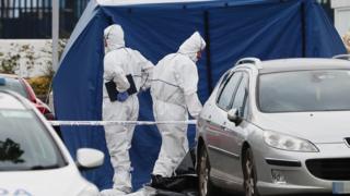 Gardaí in forensic suits at the scene of a shooting
