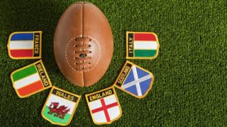 Rugby ball with nation badges.