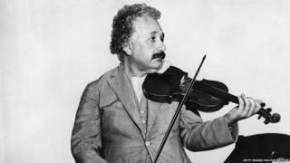his heavily retouched photograph shows German-Swiss-American mathematical physicist Albert Einstein (1879 - 1955) as he plays a violin in the music room of the S.S. Belgenland en route to California, 1931.