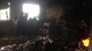 One of the first images from inside the tower shows a small fire still burning inside one flat