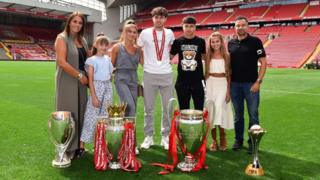 Neco with his family at Anfield