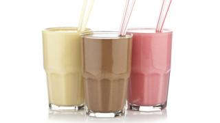 Glasses of different flavored shakes