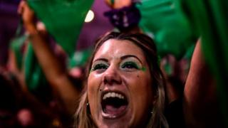 Thousands of women hold green scarves demanding the the decriminalization of abortion as they protest at Argentina's National Congress in Buenos Aires