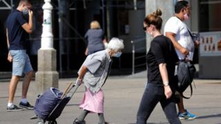 People wearing masks walk in Zagreb, Croatia. Photo: September 2020