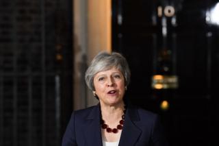 Theresa May talking to the media in front of 10 Downing Street