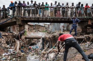 Volunteer clean the drainage during the community cleanup event supported by UN Environment at Kibera slum in Naiorbi, Kenya, on Africa day which commemorates the founding of the Organisation of African Unity (OAU now the AU), on May 25, 2018