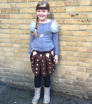 Coco is dressed as Astrid from How To Train A Dragon. Coco and her mum made this whole costume from felt, clay and silver card for the shoulder pads.