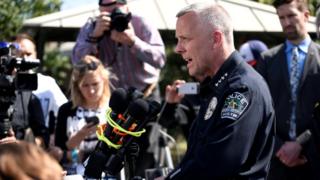 Police chief Brian Manley speaks during a news conference near the scene where a woman was injured in a package bomb explosion in Austin, Texas on March 12
