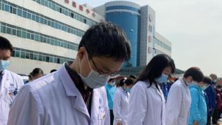 Medics in Wuhan mourn those who have died from coronavirus in China