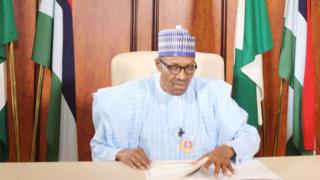 President Muhammadu Buhari dey give speech