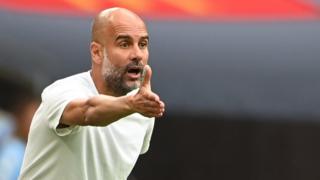 Manchester City'ss manager Pep Guardiola on the directing his player from the sideline