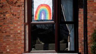 A hand-drawn picture of a rainbow is seen in a window in Liverpool, as the spread of coronavirus disease (COVID-19) continues. Liverpool, Britain