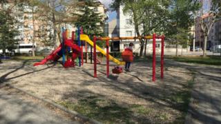 Child playing on swings in Karaman, Turkey (April 2016)