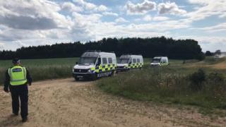 Police vans at rave site