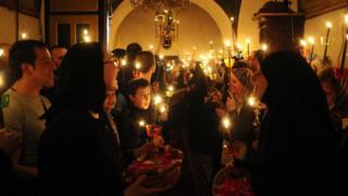 Christian Orthodox nuns sing as they celebrate the resurrection of Jesus Christ during an Easter service in the 10th Century monastery of St. John the Baptist, near Mavrovo, 130 km (81 miles) west of Macedonia's capital Skopje