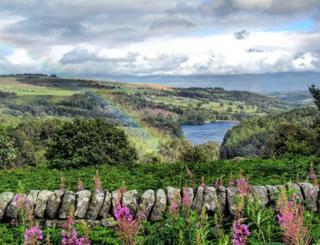 A rainbow over hills