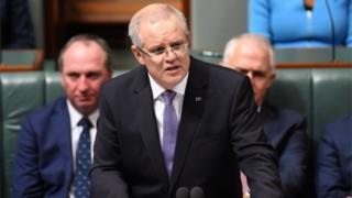 Australian Federal Treasurer Scott Morrison (C) speaks during the delivery of the 2017-18 Federal Budget in the House of Representatives at Parliament House in Canberra, Australia,
