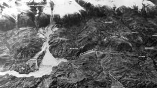 Aerial view showing the mountain range and the towns it buried