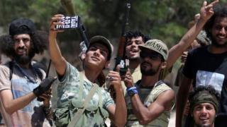 Members of the Libyan army's special forces take a selfie before entering the area of clashes with Islamist militants in their last stronghold in Benghazi, Libya, July 5, 2017