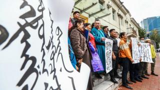 Protesters show their support in neighboring Mongolia