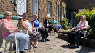 Charlotte Levy is the lady in the white and pink flowery top, Margaret Woods in the blue.