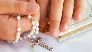 Rosary beads in hands