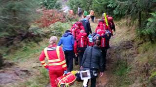 Aberdyfi Search and Rescue Team carry the patient following the incident
