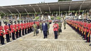Uganda's long-time President Yoweri Museveni, 71, centre, inspects the honour guard during his inauguration ceremony in the capital Kampala (12 May 2016)