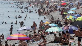 People cool off in the sea in Nice, France