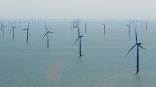 Aerial view over the offshore wind farm off the Lincolnshire coast near Grimbsy, England