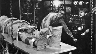 Colin Clive, as Dr. Frankenstein, and Dwight Frye, as his assistant Fritz, prepare to bring their monster to life in a scene from the 1931 movie version of Mary Shelley's Frankenstein.