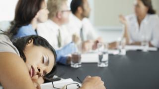 woman asleep on desk
