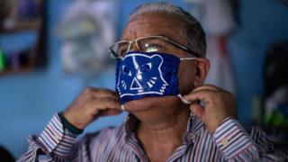 Coronavirus: Mexican wrestlers sew Lucha Libre face masks - BBC News