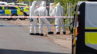 Forensic officers at scene of sudden death