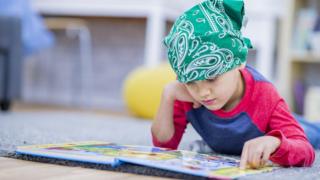 Child reading a book