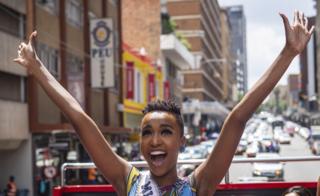 Miss Universe Zozibini Tunzi waving aboard an open-topped bus in Johannesburg, South Africa - Thursday 13 February 2020