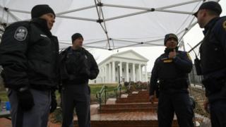 Law enforcement personnel manage a security checkpoint next to the Virginia State Capitol building in Richmond on 18 January 2020.