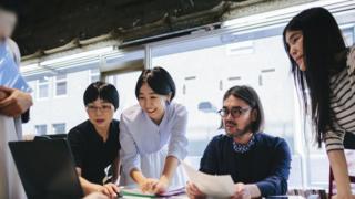 Women and men in an office in Japan