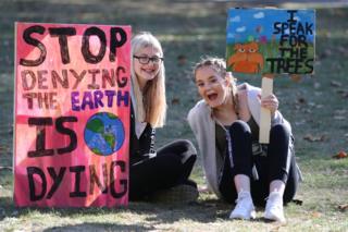 Protesters in London holding placards