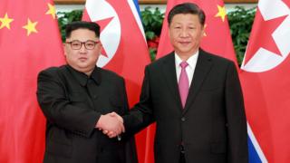 XI JINPING AND KIM JONGUN