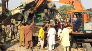 Diggers used on mangled wreck of train carriage - 3 November