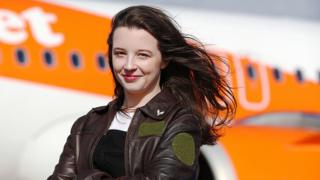 Ellie Carter standing outside a plane