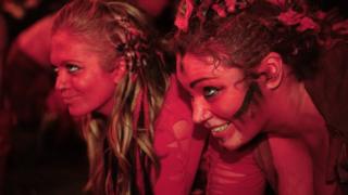 Two participants painted red