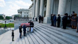 The casket carrying Congressman John Lewis arrives on the East Front of the US Capitol