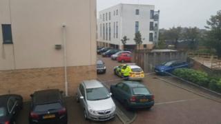 Sandhurst Place with a police car outside