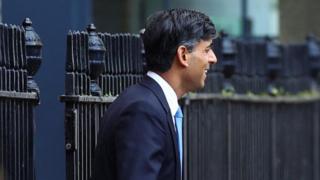 British Prime Minister Rishi Sunak walks outside 10 Downing Street