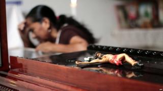 A woman attends the wake of vigilante group leader Miguel Angel Jimenez Blanco in Xaltianguis, Guerrero State, Mexico, on August 9, 2015.